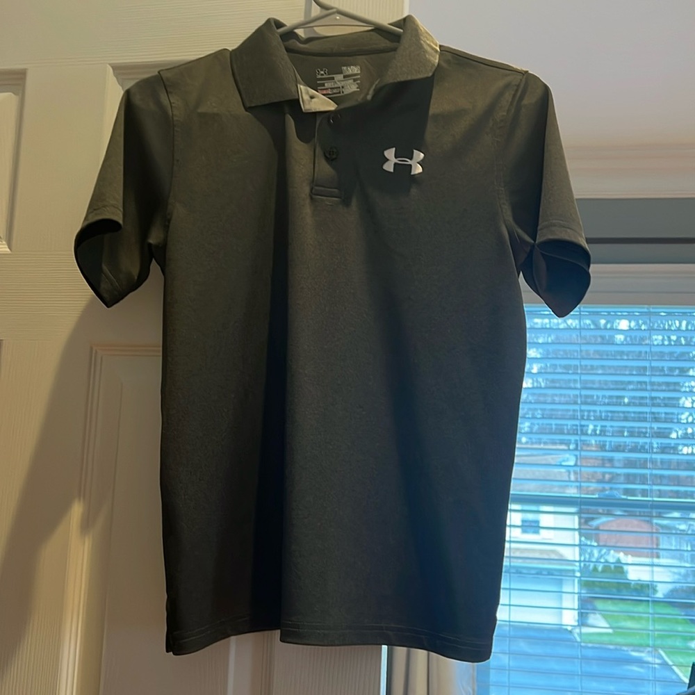 Child size large dark grey under armour polo. Excellent condition